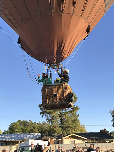 Student and adult fly in a hot air balloon